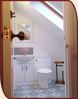 Upstairs toilet room at Coach House cottage