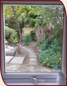 Garden view from the kitchen window at Coach House Cottage